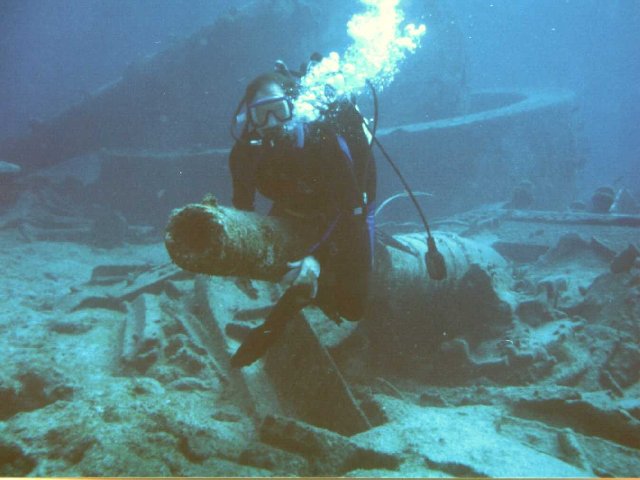 Diver on one of the Infanta Maria Teresa's secondary guns.
