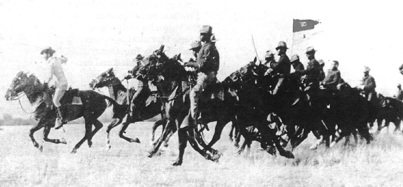 Buffalo Soldiers - This photograph shows what was probably a staged charge by the 10th Cavalry. The "Charge" as a military tactic was not often used in the West. As a matter of fact, most Cavalry troopers left their sabers in their barracks. The swords rattled and simply created noise that could give away a troopers position.