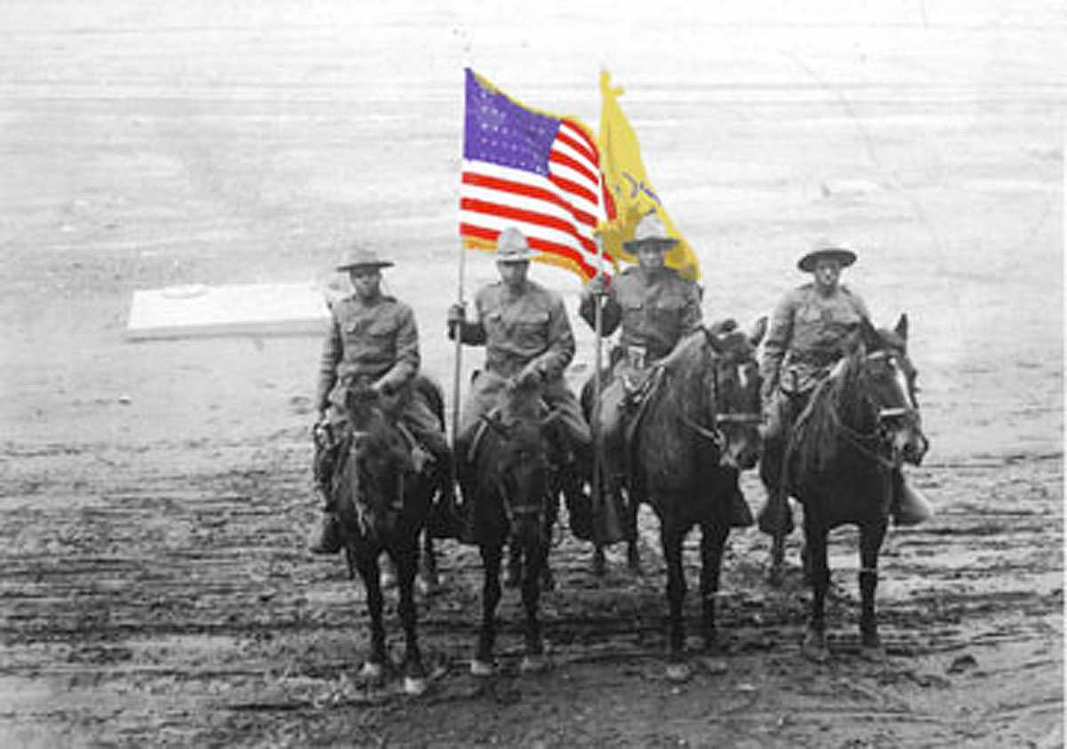 Buffalo Soldiers - This is a 10th Cavalry Color Guard, probably photographed in 1917 or 1918. The uniforms are in transition but the blue and gold have been replaced by olive drab.