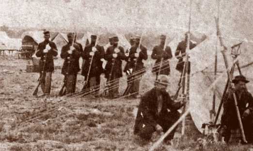 Buffalo Soldiers - A rare photo of the 38th Infantry, shown here behind workmen in Kansas, acted as escort for railroad workers surveying and engineering major lines as they began to cross the country just after the Civil War. The 38th along with the 39th, 40th and 41st were combined in 1869 into two units, the 24th and 25th.
