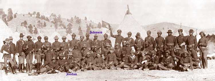 Buffalo Soldiers - The 9th Cavalry, "K" Company in Pine Ridge, South Dakota. This photograph was taken during the winter of 1890-91. Note the heavier coats, many Buffalo hide, and hats. Two men pictured here are Medal of Honor Winners- George Jordan, seated, and Henry Johnson, standing in rear.