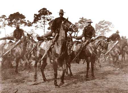 Buffalo Soldiers mount their horses around the turn of the Century. This photo was taken in Florida or Georgia as troopers prepared for battle in Cuban during the Spanish American War of 1898.