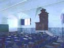 An original classroom with s tile and a pulpit