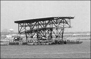 A span of the George P. Coleman Bridge is floated into place near Yorktown, Va.