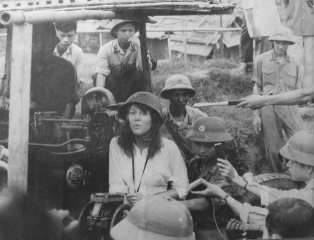 Vietnam War - What part did Jane Fonda Play? Jane Fonda sitting on a seat of an anti-aircraft gun