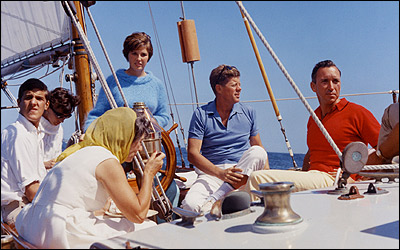 Vietnam War - John Forbes Kerry, left, sails with President John F. Kennedy aboard the 62-foot Coast Guard yawl Manitou in Narragansett Bay on Aug. 26, 1962. White House Photo / Robert Knudsen, courtesy JFK Library)
