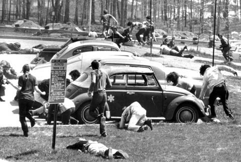Vietnam War - Students running for cover in a Kent State parking lot