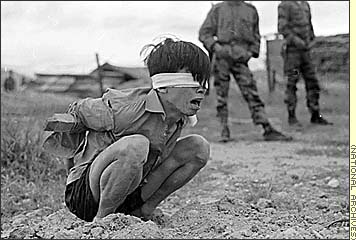 Vietnam War - Combat Chronicles, Photographs of the Vietnam War Part 1 - Viet Cong prisoner, A Viet Cong prisoner awaits interrogation at a Special Forces detachment in Thuong Duc, Vietnam, 15 miles (25 km) west of Danang, January 1967